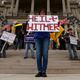 A protester with an... unfortunate sign outside the state house in Michigan on April 15, 2020.